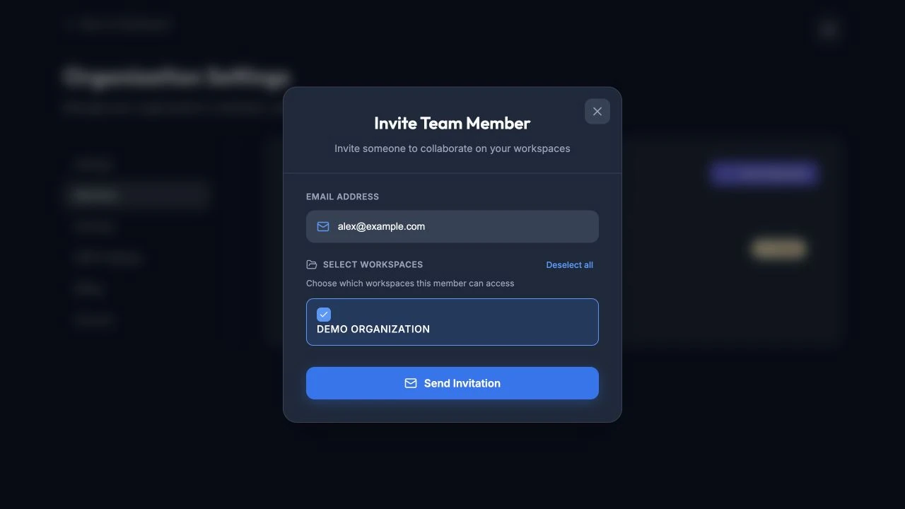 Organization Members page with the Invite Team Member dialog filled with a safe example address.